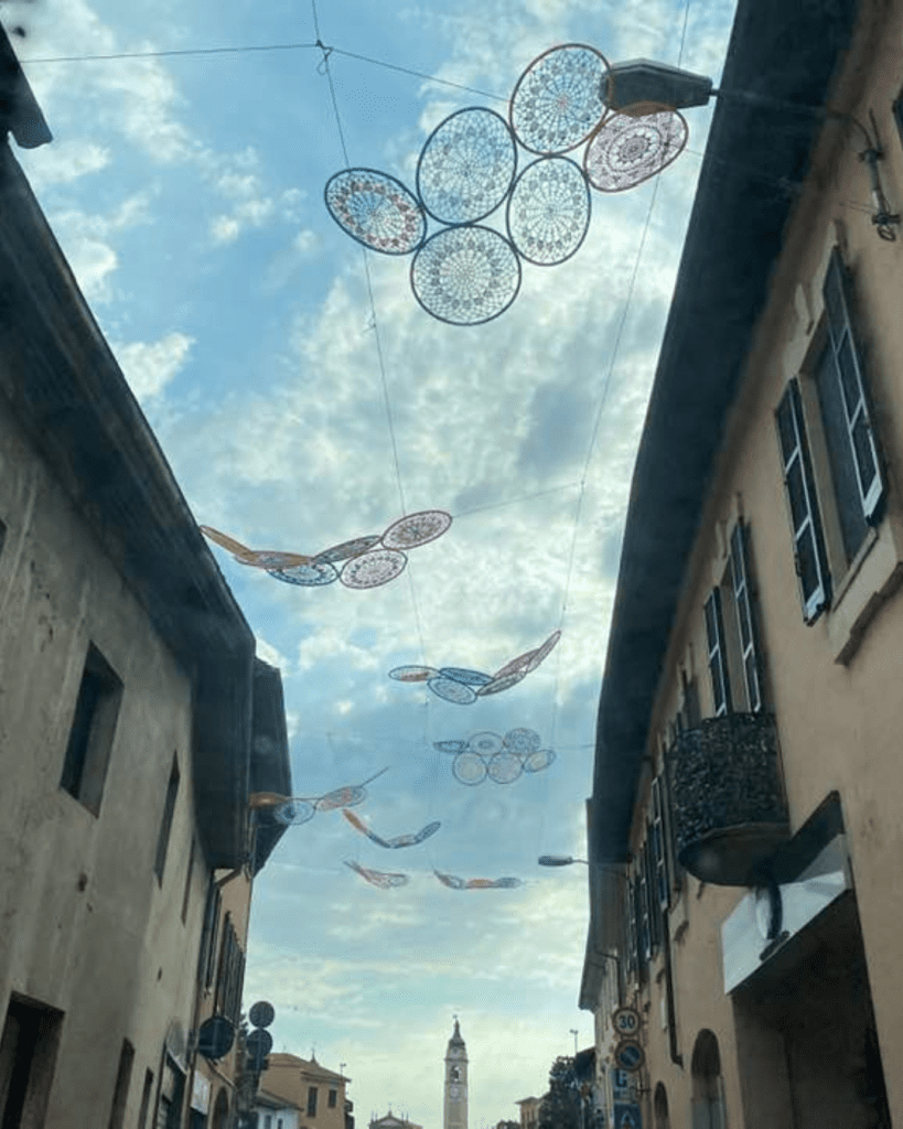 Decorations above walkway in Italy
